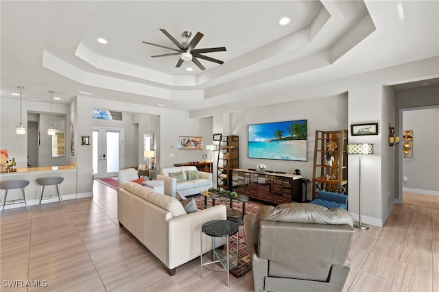4382 Caldera Cir, Naples, FL 34119 - living area featuring a raised ceiling, ceiling fan, recessed lighting, and baseboards