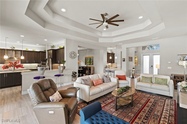 4382 Caldera Cir, Naples, FL 34119 - living area with a raised ceiling, a ceiling fan, and recessed lighting