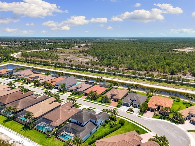 4382 Caldera Cir, Naples, FL 34119 - aerial perspective of suburban area with a nearby body of water and a forest