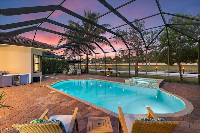 4382 Caldera Cir, Naples, FL 34119 - view of pool featuring a patio area, a pool with connected hot tub, and a lanai