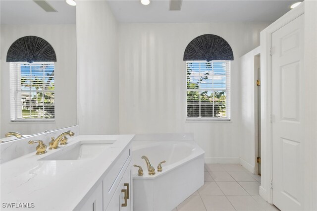 7 Blue Hill Ct, Marco Island, FL 34145 - bathroom featuring tile patterned flooring, a bath, vanity, and baseboards