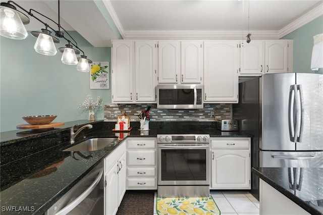 8161 Twelve Oaks Cir Unit 512, Naples, FL 34113 - kitchen featuring appliances with stainless steel finishes, a sink, white cabinets, dark stone countertops, and tasteful backsplash