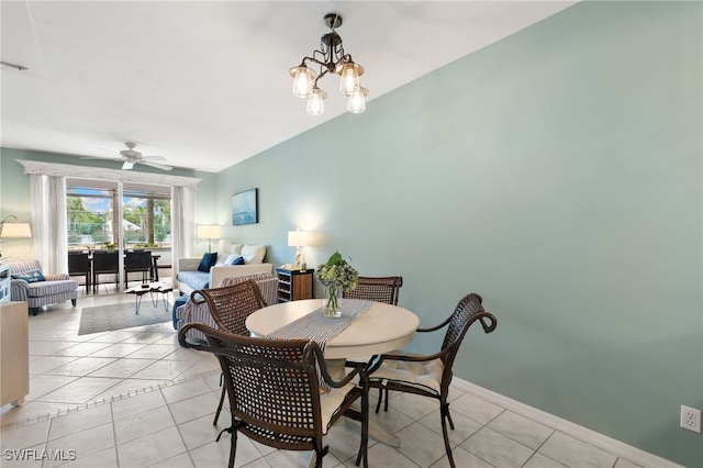 8161 Twelve Oaks Cir Unit 512, Naples, FL 34113 - dining space featuring a ceiling fan, a chandelier, and light tile patterned flooring
