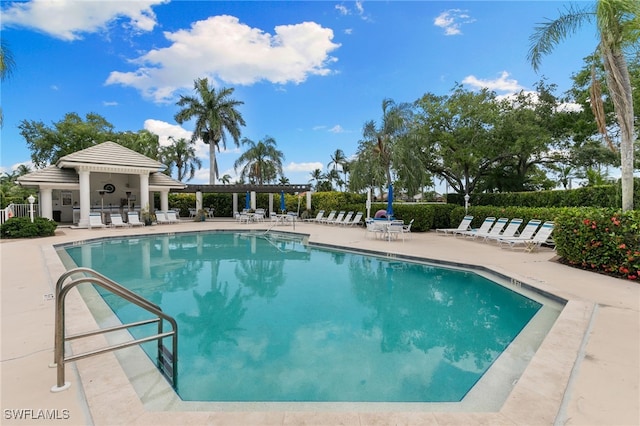 8161 Twelve Oaks Cir Unit 512, Naples, FL 34113 - community pool with a patio area