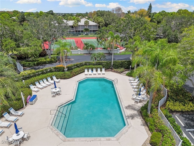 8161 Twelve Oaks Cir Unit 512, Naples, FL 34113 - community pool with a patio and view of scattered trees