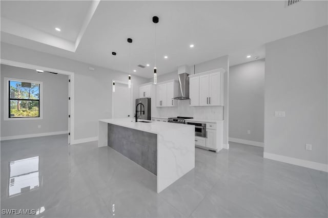 1116 Nimitz Blvd, Lehigh Acres, FL 33974 - kitchen with appliances with stainless steel finishes, a sink, white cabinetry, a kitchen island with sink, and recessed lighting