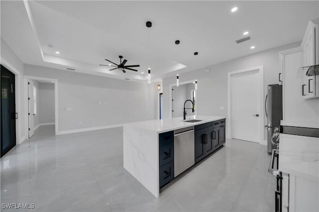 1116 Nimitz Blvd, Lehigh Acres, FL 33974 - kitchen featuring stainless steel appliances, an island with sink, a sink, white cabinetry, and recessed lighting