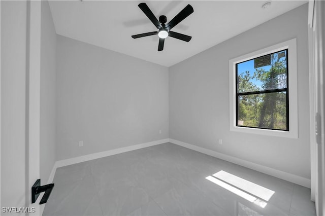 1116 Nimitz Blvd, Lehigh Acres, FL 33974 - tiled empty room featuring baseboards and ceiling fan