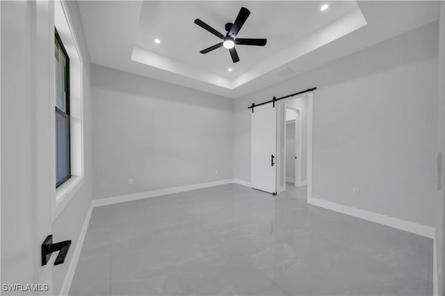 1116 Nimitz Blvd, Lehigh Acres, FL 33974 - unfurnished room featuring recessed lighting, a ceiling fan, a raised ceiling, a barn door, and baseboards