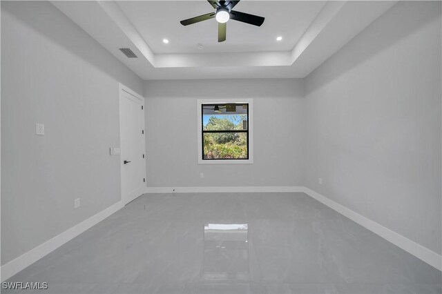 1116 Nimitz Blvd, Lehigh Acres, FL 33974 - unfurnished room with a tray ceiling, a ceiling fan, baseboards, and recessed lighting