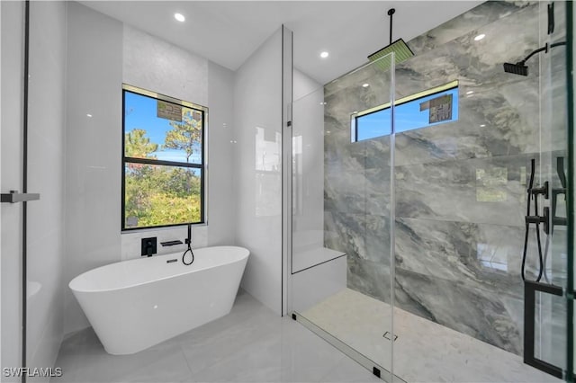 1116 Nimitz Blvd, Lehigh Acres, FL 33974 - bathroom featuring a freestanding tub, a marble finish shower, marble finish flooring, and recessed lighting