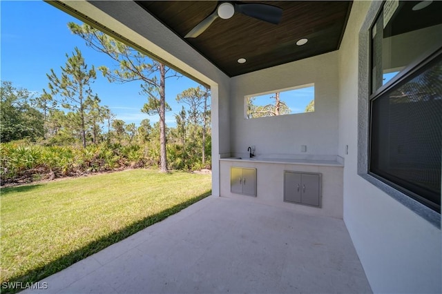 1116 Nimitz Blvd, Lehigh Acres, FL 33974 - view of patio / terrace with ceiling fan, an outdoor kitchen, and a sink