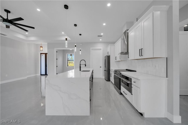 1116 Nimitz Blvd, Lehigh Acres, FL 33974 - kitchen with appliances with stainless steel finishes, ceiling fan, a large island with sink, white cabinets, and recessed lighting