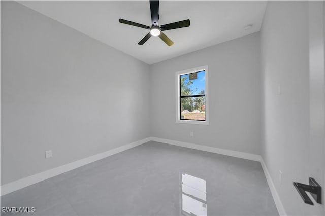 1116 Nimitz Blvd, Lehigh Acres, FL 33974 - unfurnished room with baseboards, a ceiling fan, and concrete floors