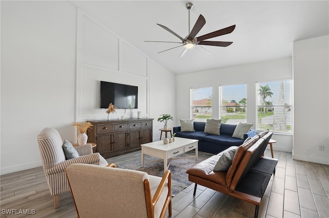 5233 SW 11th Ct, Cape Coral, FL 33914 - living room featuring a ceiling fan, light wood finished floors, baseboards, and high vaulted ceiling