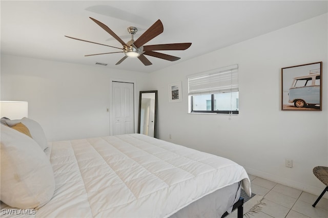 5233 SW 11th Ct, Cape Coral, FL 33914 - bedroom featuring light tile patterned flooring, a ceiling fan, and a closet
