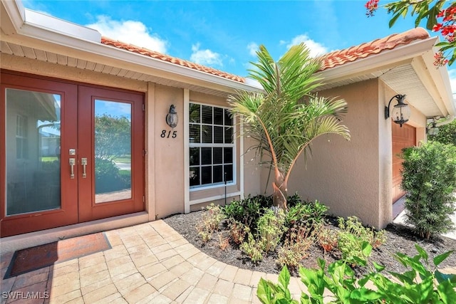 815 Rose Ct, Marco Island, FL 34145 - property entrance featuring stucco siding, french doors, and a tile roof