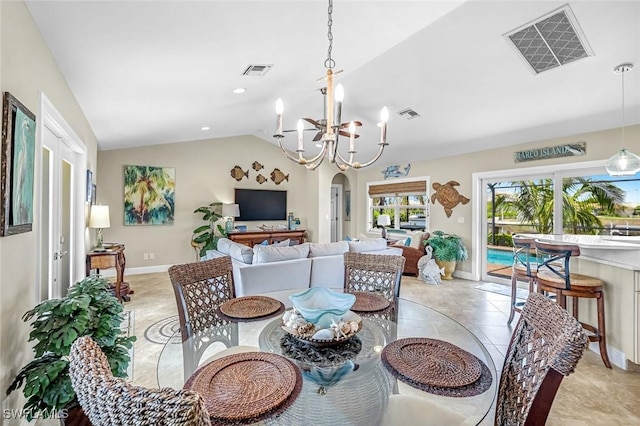 815 Rose Ct, Marco Island, FL 34145 - dining room featuring lofted ceiling, a chandelier, arched walkways, baseboards, and light tile patterned floors