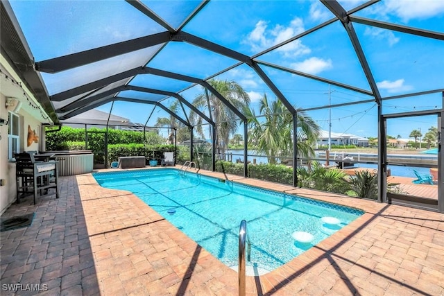 815 Rose Ct, Marco Island, FL 34145 - swimming pool with a patio area, a lanai, and a water view