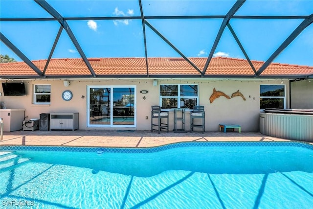 815 Rose Ct, Marco Island, FL 34145 - outdoor pool featuring a patio area and glass enclosure