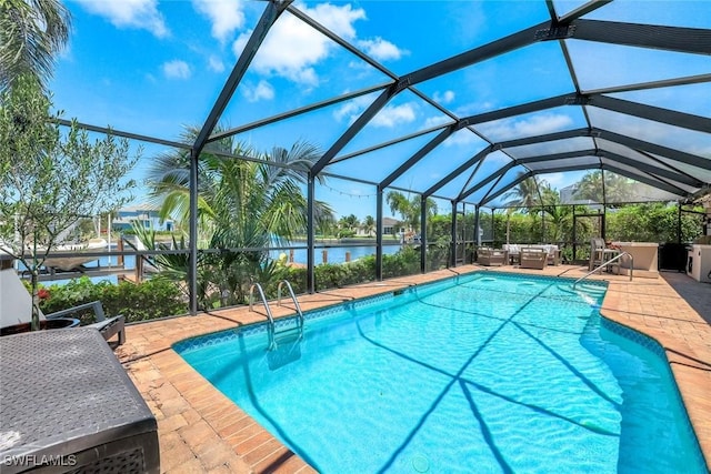 815 Rose Ct, Marco Island, FL 34145 - swimming pool featuring a patio area, a water view, a lanai, and outdoor lounge area