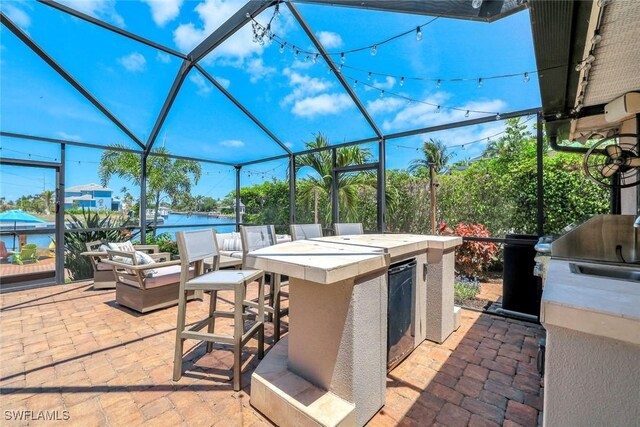 815 Rose Ct, Marco Island, FL 34145 - view of patio with a lanai and a water view