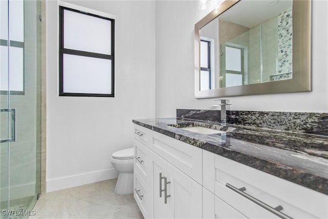 206 Jack Ave N, Lehigh Acres, FL 33971 - bathroom with baseboards, toilet, vanity, a stall shower, and marble look tiles