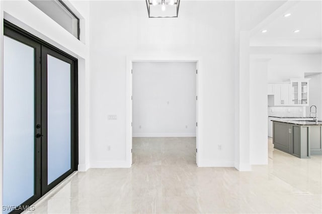 206 Jack Ave N, Lehigh Acres, FL 33971 - foyer entrance with baseboards, a towering ceiling, and recessed lighting