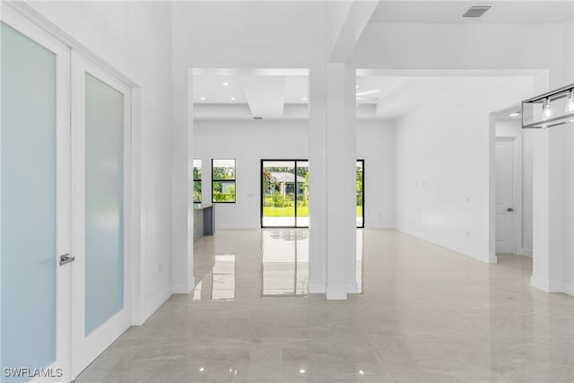 206 Jack Ave N, Lehigh Acres, FL 33971 - hallway featuring a high ceiling, baseboards, recessed lighting, and light marble finish flooring
