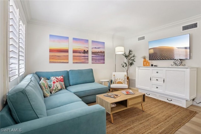 980 7th Ave S Unit 104, Naples, FL 34102 - living room featuring crown molding and light wood-style floors