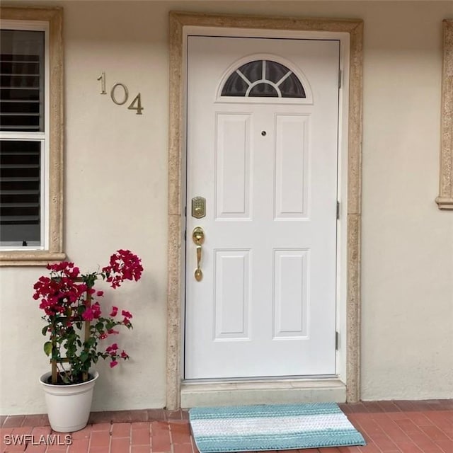 980 7th Ave S Unit 104, Naples, FL 34102 - entrance to property featuring stucco siding
