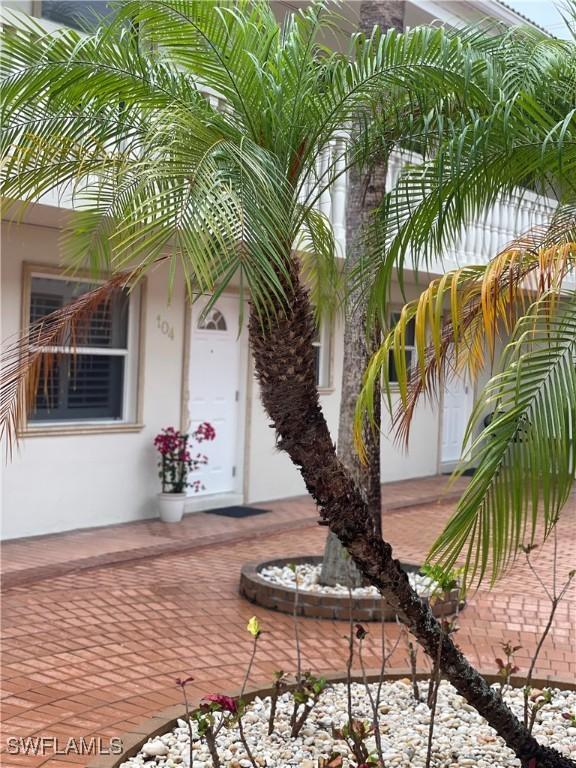 980 7th Ave S Unit 104, Naples, FL 34102 - entrance to property featuring stucco siding