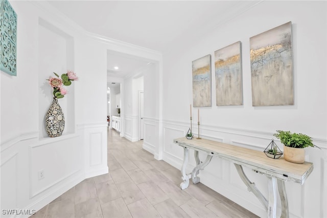 2127 Hamlin St, Naples, FL 34120 - corridor featuring a decorative wall, wainscoting, crown molding, and recessed lighting