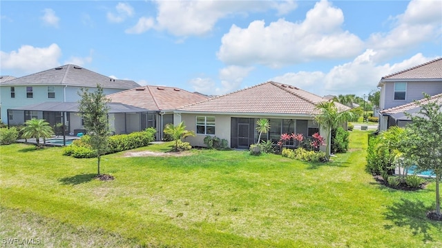 2127 Hamlin St, Naples, FL 34120 - back of house featuring a tile roof, a yard, stucco siding, and glass enclosure