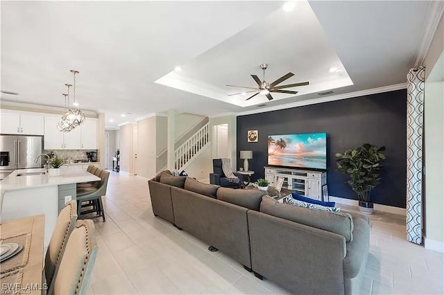 10367 Ventana Ln, Naples, FL 34120 - living area with stairs, a ceiling fan, a raised ceiling, recessed lighting, and ornamental molding