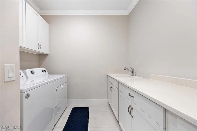 10367 Ventana Ln, Naples, FL 34120 - clothes washing area with washer and dryer, cabinet space, crown molding, and baseboards