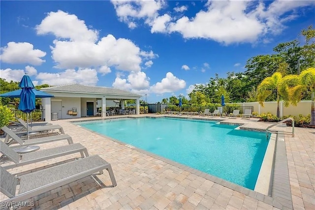 10367 Ventana Ln, Naples, FL 34120 - community pool featuring a patio area and fence