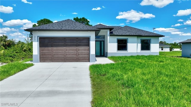 3808 2nd St W, Lehigh Acres, FL 33971 - view of front facade with driveway, stucco siding, an attached garage, roof with shingles, and a front yard