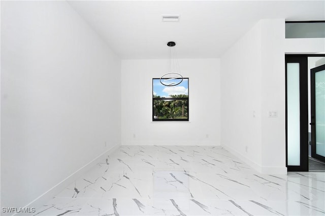 3808 2nd St W, Lehigh Acres, FL 33971 - empty room with baseboards and light marble finish floors