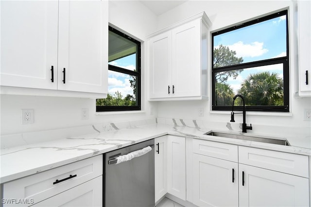 3808 2nd St W, Lehigh Acres, FL 33971 - kitchen featuring dishwasher, white cabinets, light stone countertops, and a sink