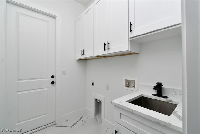 3808 2nd St W, Lehigh Acres, FL 33971 - clothes washing area with cabinet space, light marble finish flooring, electric dryer hookup, washer hookup, and baseboards