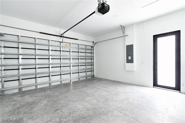 3808 2nd St W, Lehigh Acres, FL 33971 - garage featuring a garage door opener and electric panel