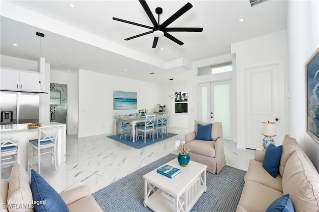 3808 2nd St W, Lehigh Acres, FL 33971 - living area with light marble finish flooring, ceiling fan, recessed lighting, and french doors