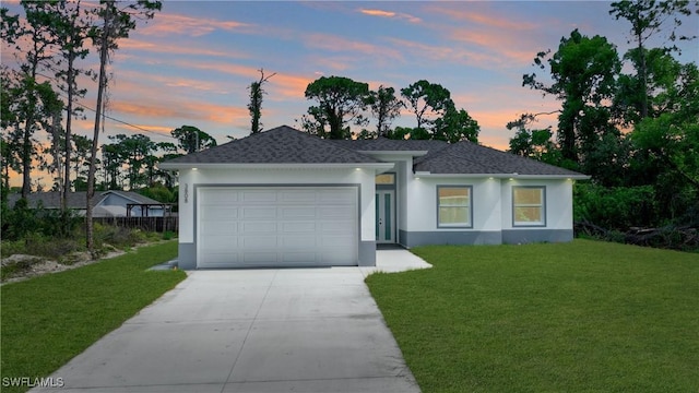 3808 2nd St W, Lehigh Acres, FL 33971 - view of front of house featuring stucco siding, driveway, a front yard, a garage, and roof with shingles