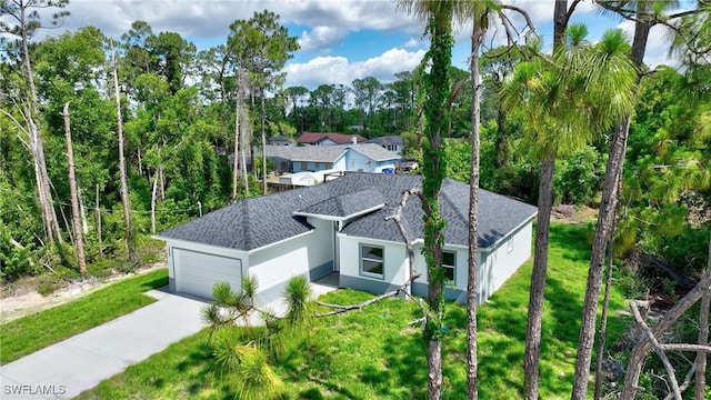 3808 2nd St W, Lehigh Acres, FL 33971 - view of subject property featuring a tree filled landscape