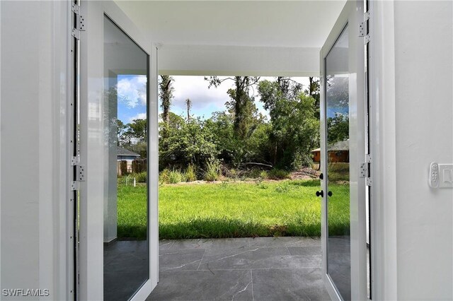 3808 2nd St W, Lehigh Acres, FL 33971 - doorway to outside featuring plenty of natural light