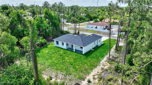 3808 2nd St W, Lehigh Acres, FL 33971 - view from above of property with a heavily wooded area