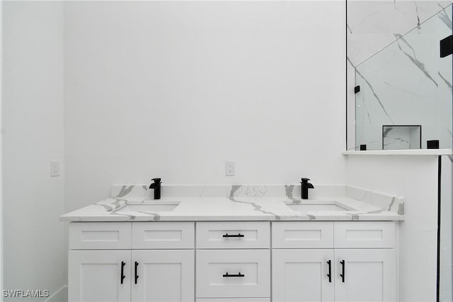 3808 2nd St W, Lehigh Acres, FL 33971 - full bathroom featuring double vanity and a marble finish shower