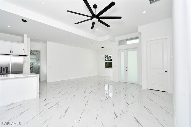 3808 2nd St W, Lehigh Acres, FL 33971 - unfurnished living room featuring a ceiling fan, recessed lighting, french doors, and light marble finish flooring
