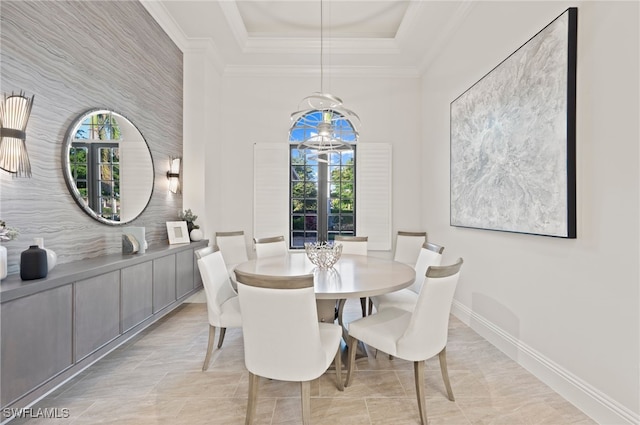 4249 Deephaven Ln, Naples, FL 34119 - dining space with healthy amount of natural light, crown molding, baseboards, a tray ceiling, and a chandelier